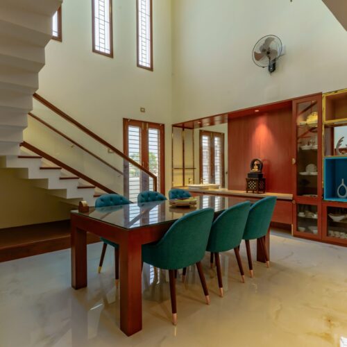 Wooden dining table under a skylight